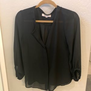 Long sleeve sheer black top. Sleeves come above wrists.